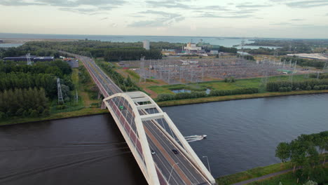 uyllander bridge crossing amsterdam-rhine canal in diemen, amsterdam, netherlands. aerial sideways shot