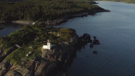 Orbit-of-lighthouse-with-bird-fly-by