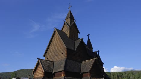 Historic-Norwegian-Heddal-Stave-wooden-Church-on-clear-blue-sky-sunny-day