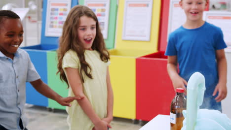 excited kids watching experiment at a science centre
