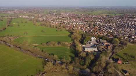 aerial view of haslington village in crewe and a534 road passing through cheshire countryside and farmland
