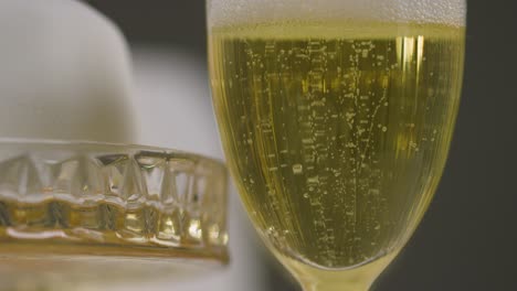 close up of champagne in glass at table set for meal at wedding reception