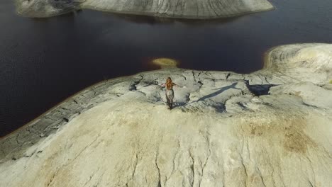 woman posing on top of a quarry