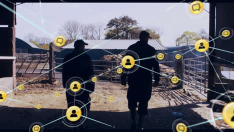 Social media network icons animation over farmers walking in barnyard