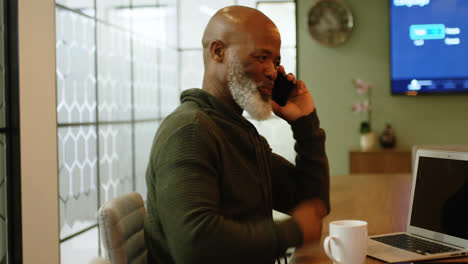 businessman having coffee while talking on mobile phone 4k