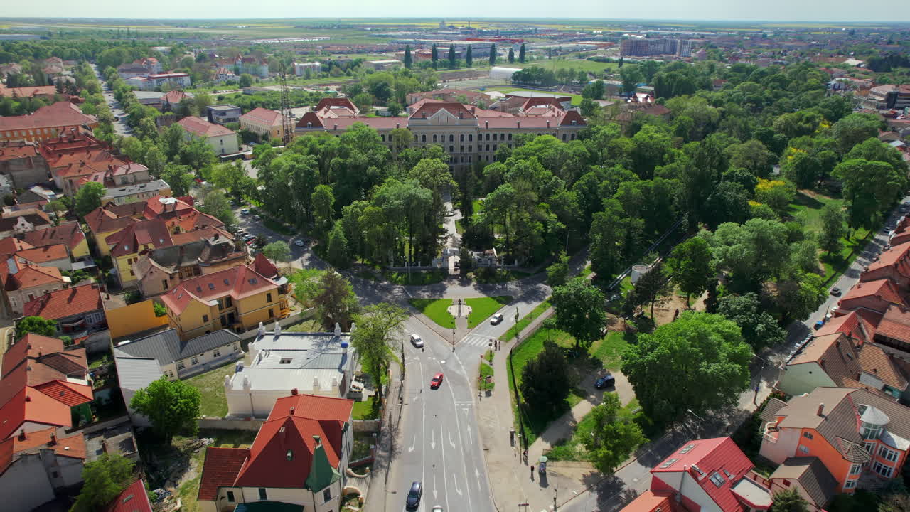 Aerial drone view of Oradea, Romania. View of the city, museum and multiple old buildings made in classic style around, greenery