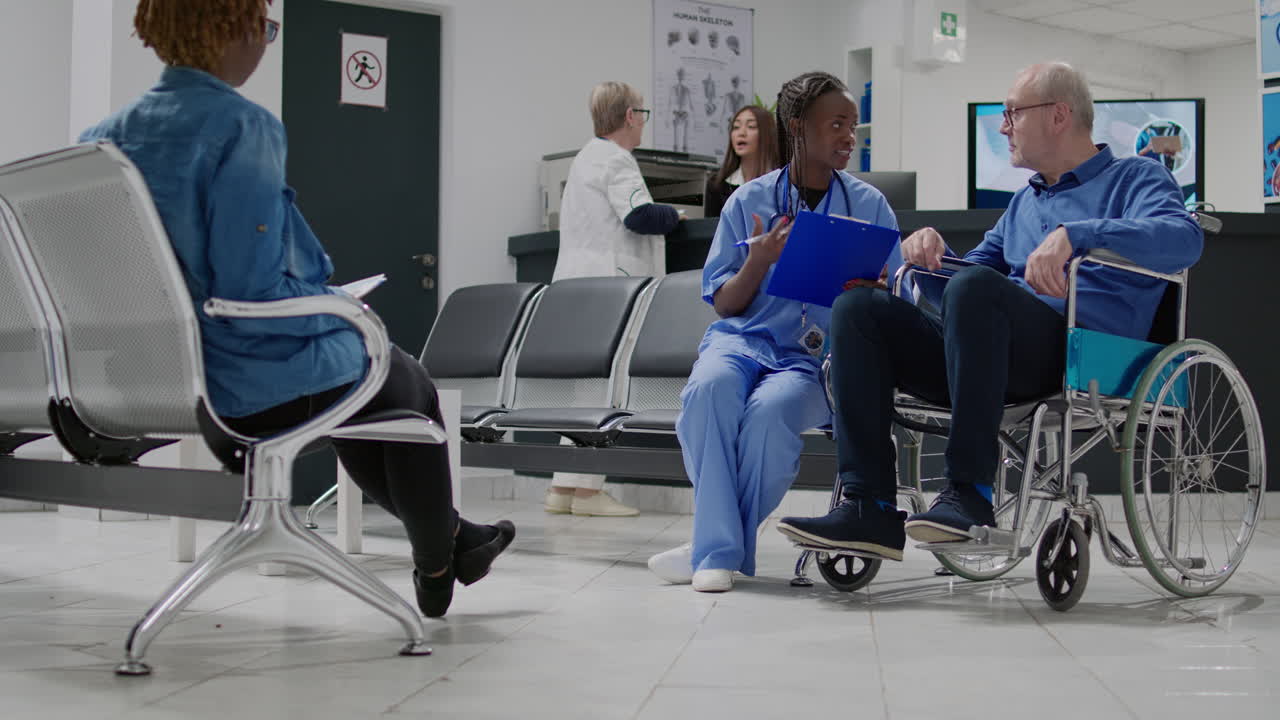 Healthcare professionals assisting patients in a hospital waiting room