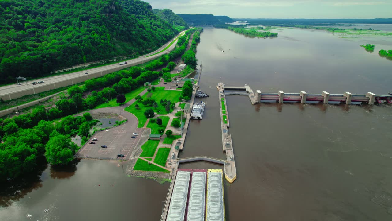 Tugboat approaching barge boat that is passing through the lock and dam system near La Crescent, Minnesota, on the Mississippi River. USA