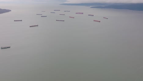 aerial-footage-of-cargo-ship-backlog-in-the-pacific-ocean,-Vancouver,-British-Columbia,-Canada