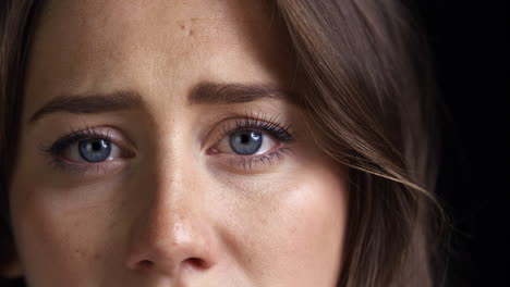 Close-Up-Of-Unhappy-Young-Woman-Looking-Sadly-Into-Camera