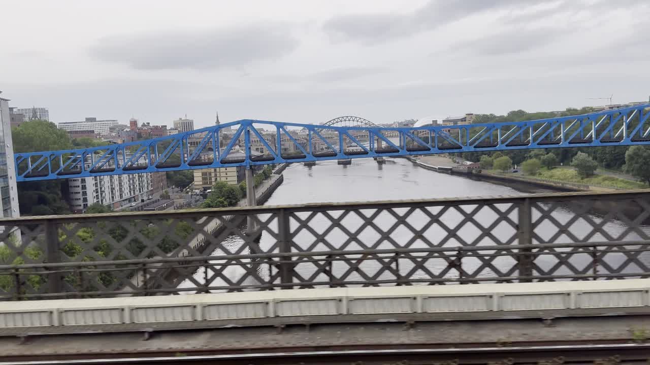 Travelling on King Edward VII Bridge with view over to Newcastle Quayside