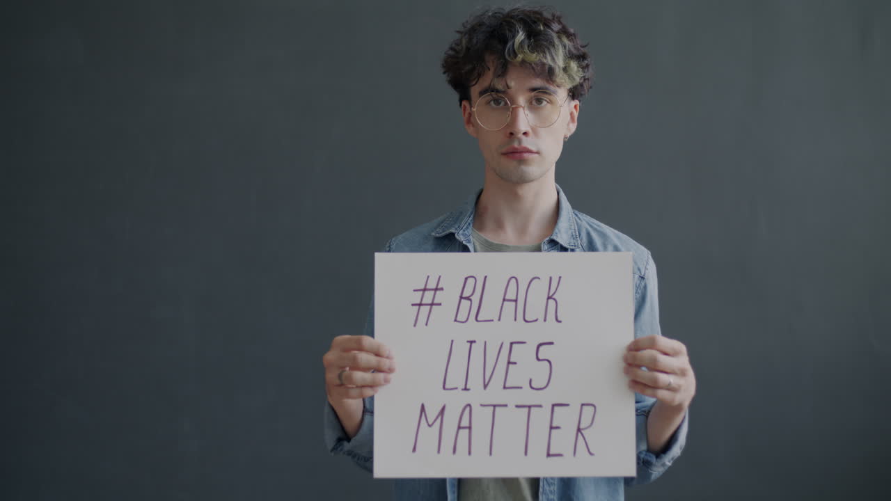 Protestor Holding a Black Lives Matter Sign