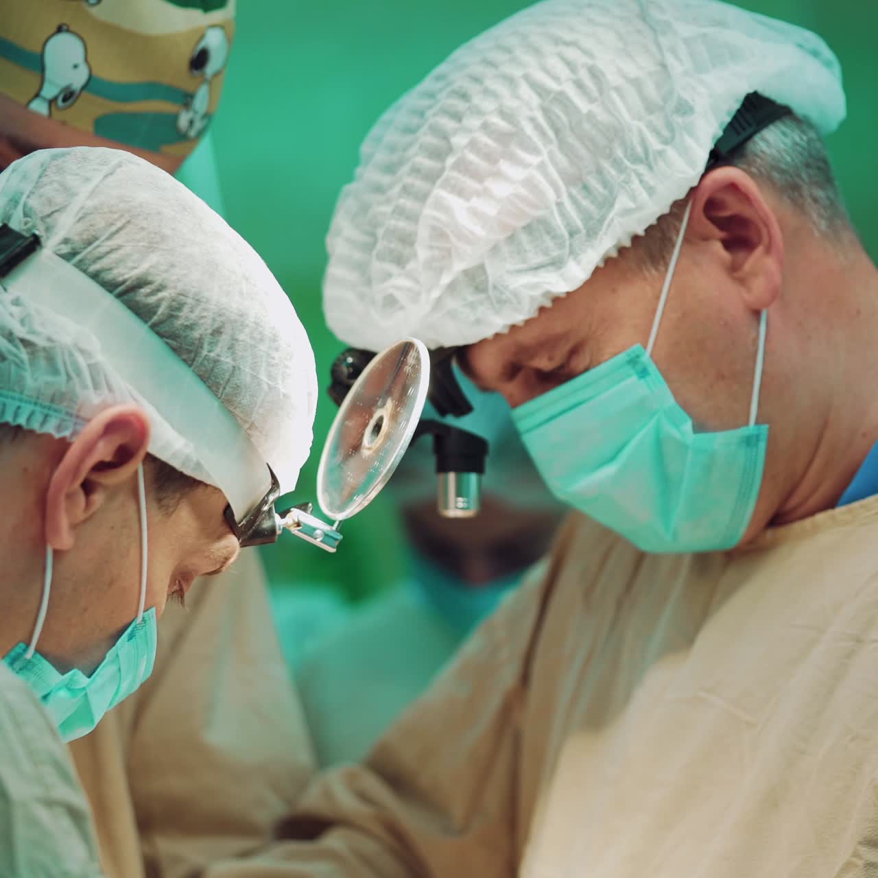 In surgery. Medical team performing operation in hospital operating theater. Working with surgical instruments.