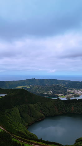 surrealistic rocky landscape of the azorean islands. picturesque crates of sleeping volcanoes filled with lakes. top view. vertical video.