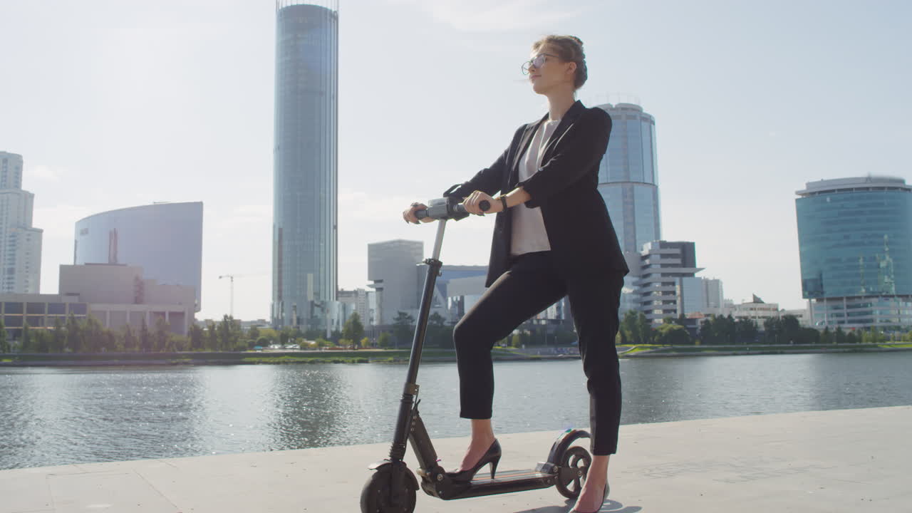 Portrait Of Business Woman With E-Scooter