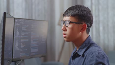 young programmer concentrating on code