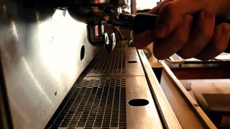 close up view of chrome espresso machine pouring steaming hot double shot coffee into glass cups