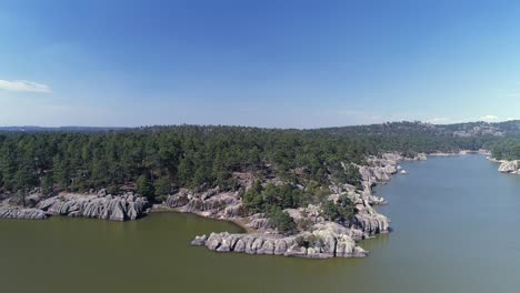 aerial jib up shot of the arareco lake in the copper canyon region, chihuahua