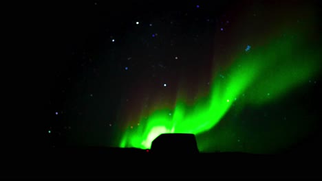 distant norther lights above a parked vehicle