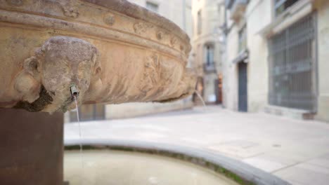 empty streets in countryside village with fountain pouring, emptiness scenery during lockdown during the covid-19 pandemic