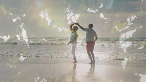 animación de luz brillante sobre una feliz pareja de ancianos bailando a la orilla del mar