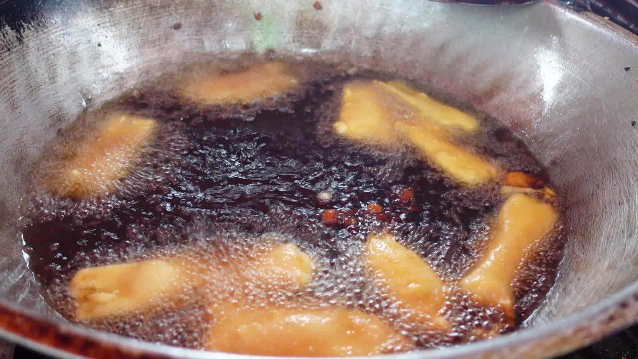 Food being fried in a wok