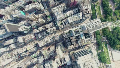 Central-Hong-Kong,-top-down-aerial-view-of-traffic-and-city-skyscrapers