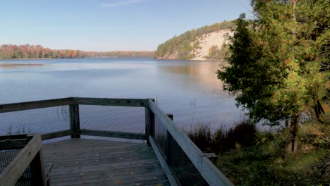 au sable river in michigan during fall colors with gimbal video walking along pathway