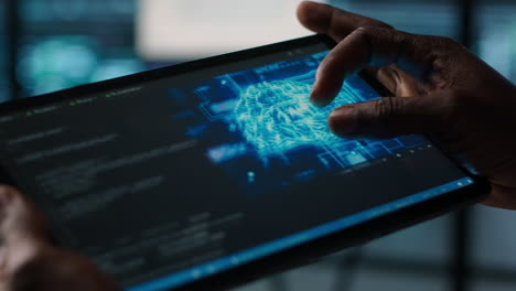 close up of computer scientist in data center uses ai on tablet