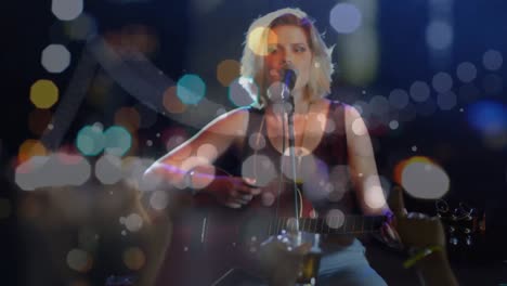 Animation-on-blurred-night-road-traffic-over-caucasian-female-singer-on-concert