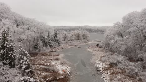 drone through winter river and lake