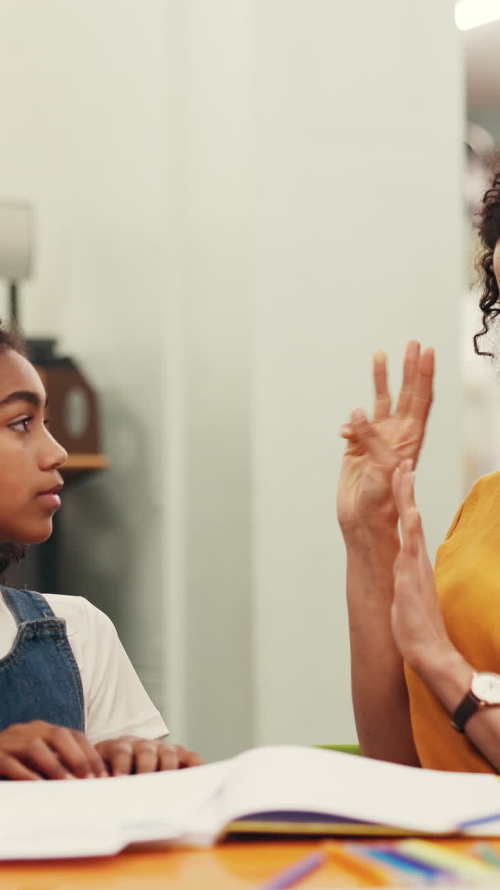 Woman and Girl Learning Together with Hand Gestures