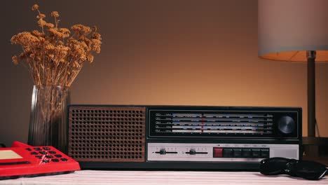 old retro am fm radio with tubes, hand changing stations , bulb vintage music player.