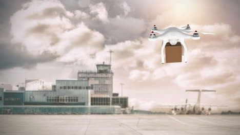 drone llevando una caja en un aeropuerto