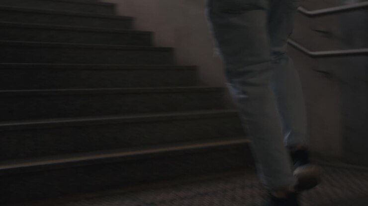 Young Man is Running up Stairs in Cool Sneakers and Jeans, Handheld