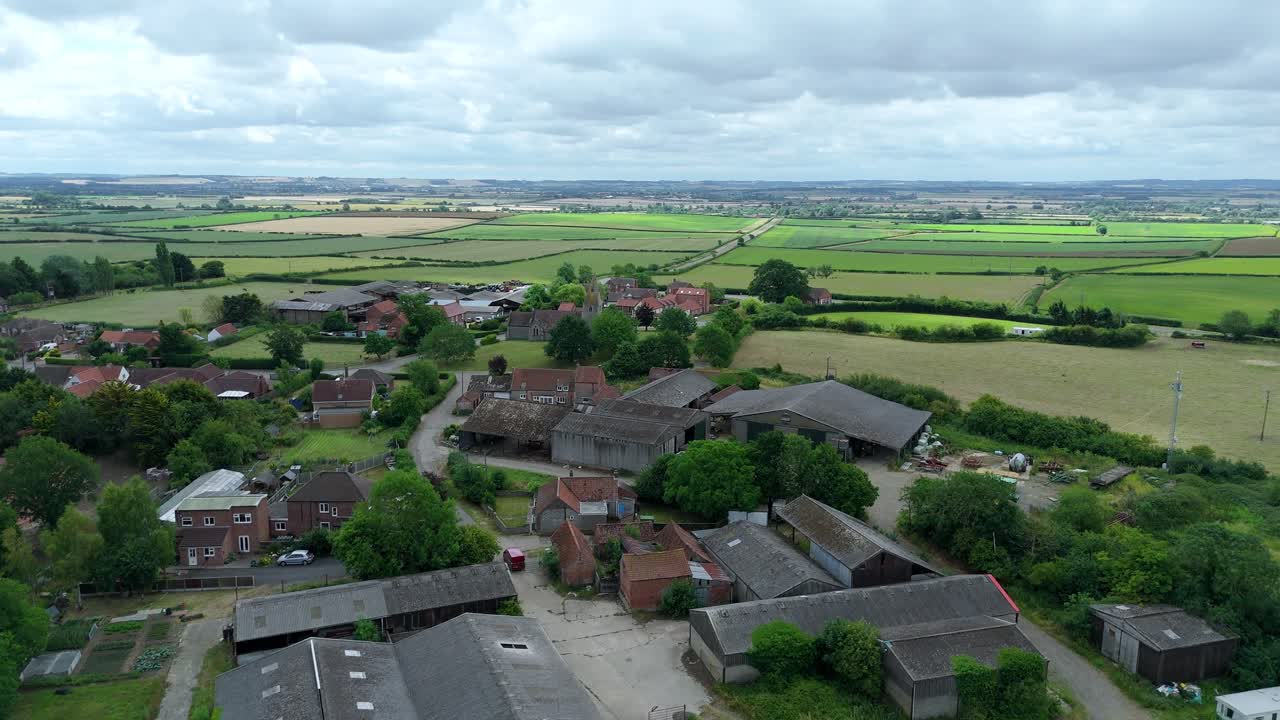 Aerial view of small village in England sunny summers day rural landscape fields