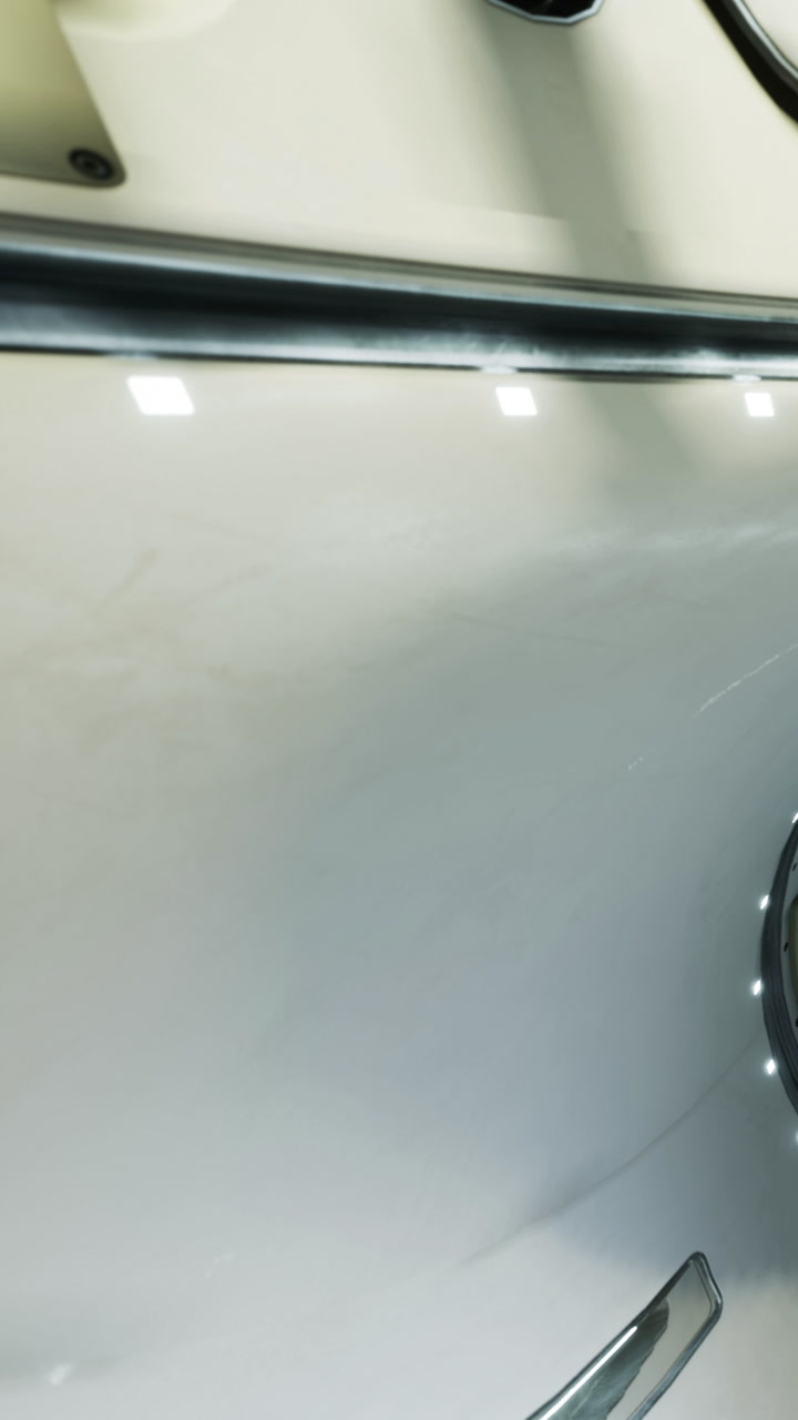 White surface with circular feature shows reflections in bright light