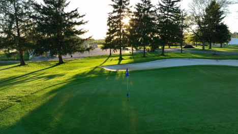 Rotating-drone-shot-of-golf-course-flag