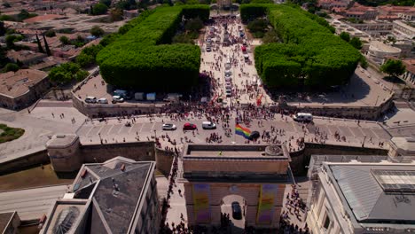 slow establishing shot of people turning up to the gay pride event in montpellier