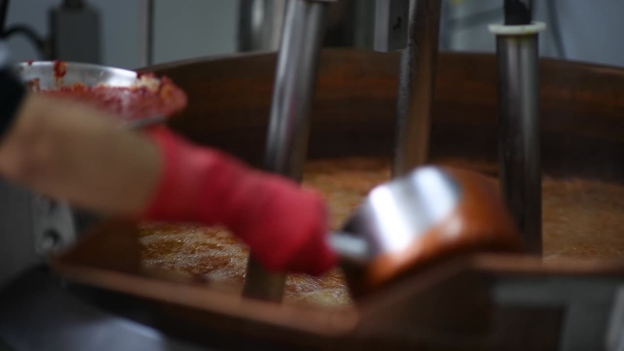 Machine mixing spice at food factory for mass production
