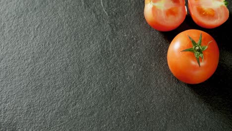 full and half tomatoes arranged on concrete background 4k 4k