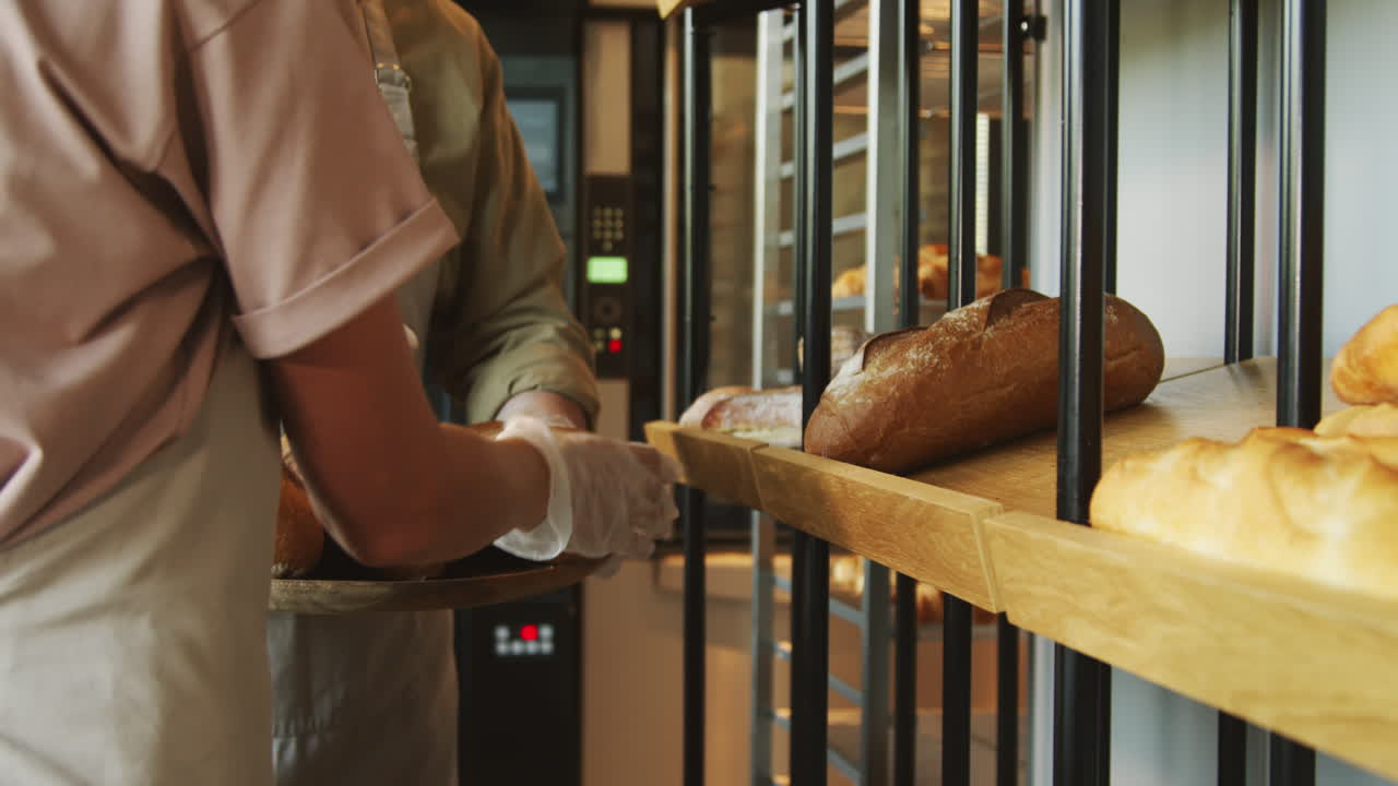 Bakery Workers Putting Bread on Shelf