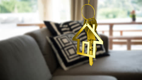 animation of gold key and house key ring over blurred house interior