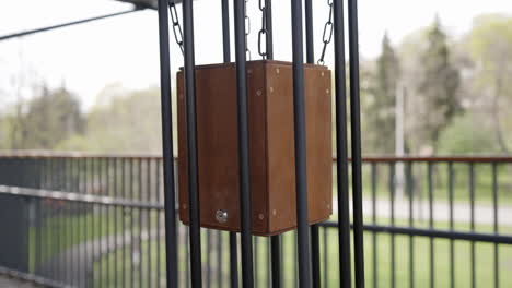 wooden box suspended in metal frame