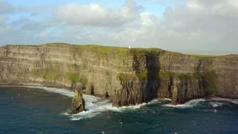 vast vista of cliffs of moher from the sea, aerial orbiting shot