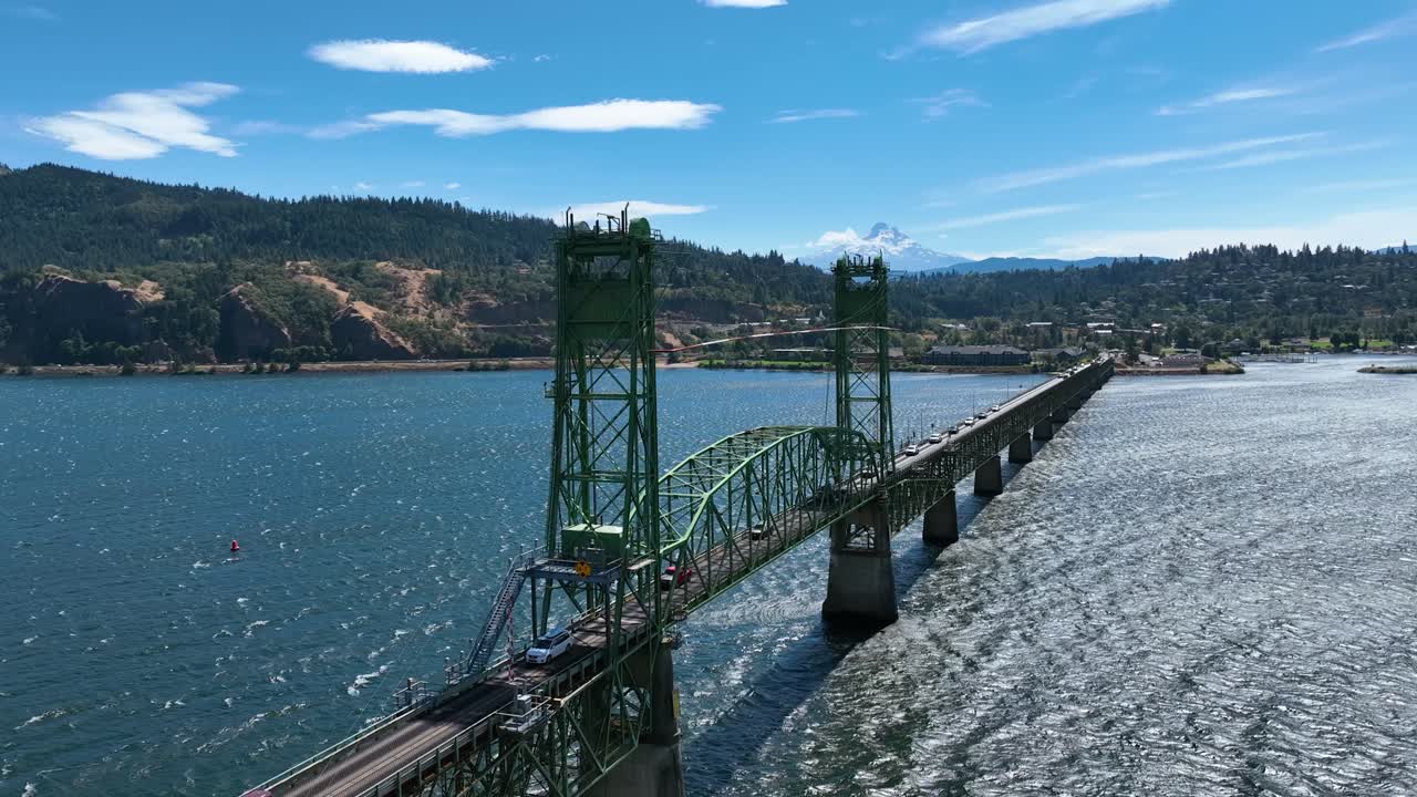 Drone circling traffic on the Hood river bridge, sunny day in Oregon, USA