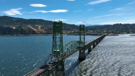 drone circling traffic on the hood river bridge, sunny day in oregon, usa