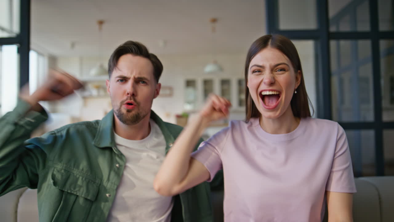 Family supporting sport victory sitting couch cheering favorite team closeup