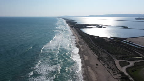 Mediterranean-coastline-aerial-view-sandy-beach-sea-and-ponds-landscape-France