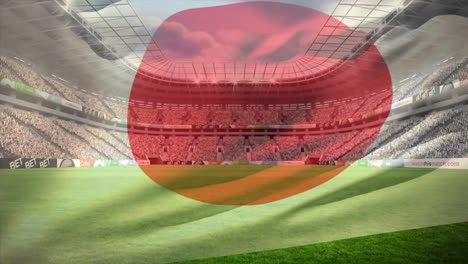 stadium full of supporters with a japanese flag floating on the foreground